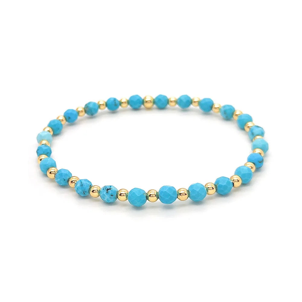 Bracelet vintage avec des perles turquoises et une croix en pendentif