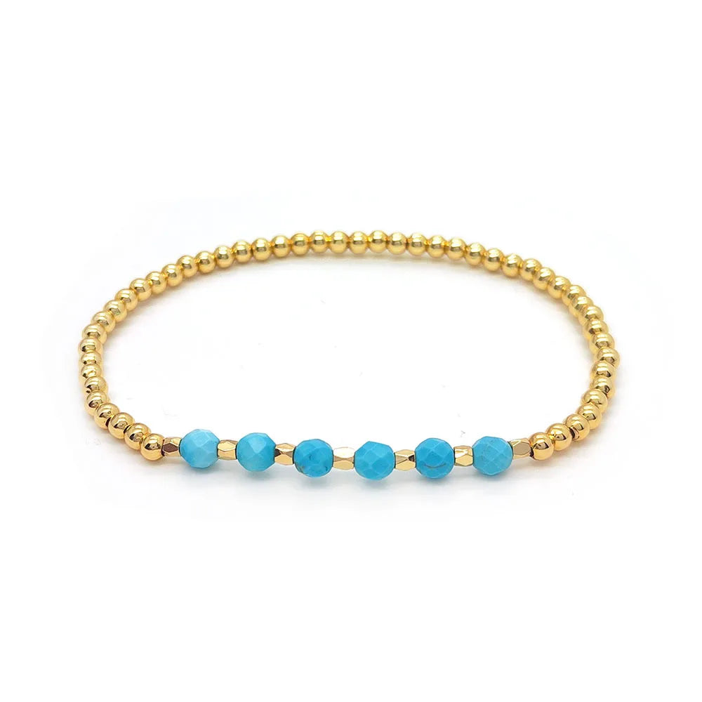 Bracelet vintage avec des perles turquoises et une croix en pendentif