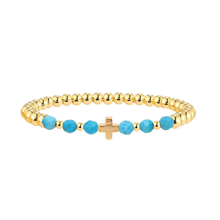 Bracelet vintage avec des perles turquoises et une croix en pendentif