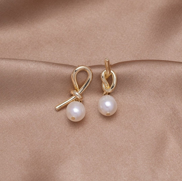 Tereza-Sofie – Boucles d'oreilles en argent de forme courbe.
